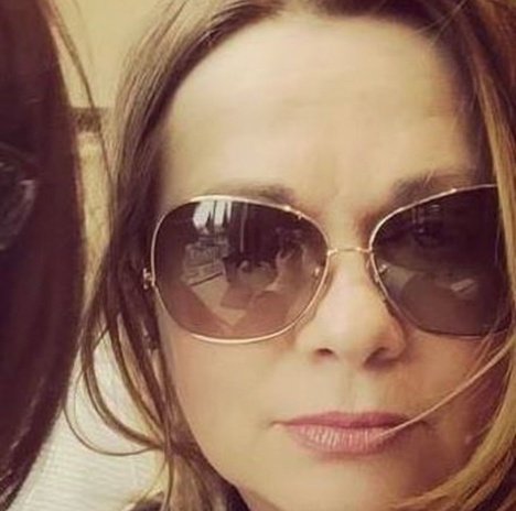 Liz Steinhart wearing sunglasses, close-up portrait